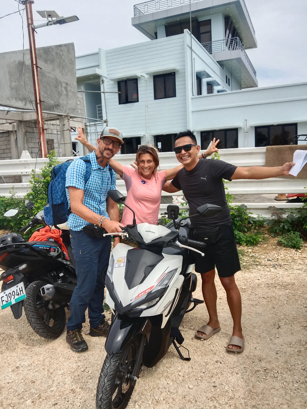 Travelers at Siquijor Airport on Honda Click 125 scooter